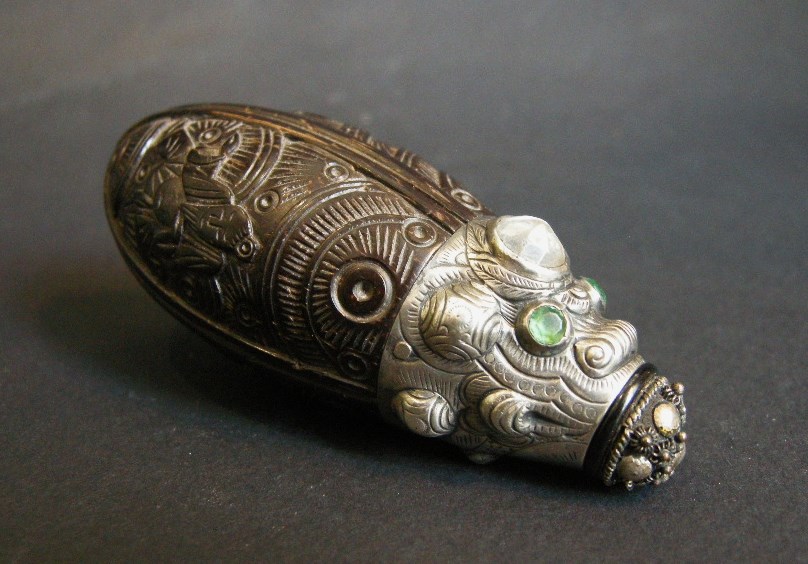 Coconut snuff bottle sculpted with silver mount stone embelishement